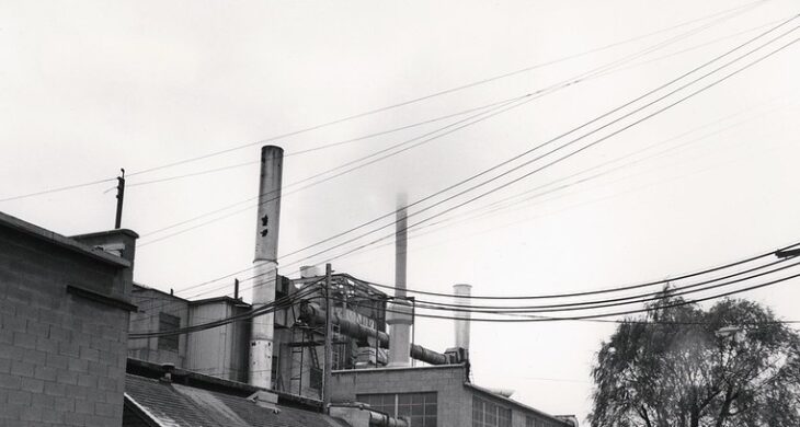 U.S. Department of Energy "Exterior of ... Paper Mill with Heat Extractor ... Between Two Smoke Stacks."