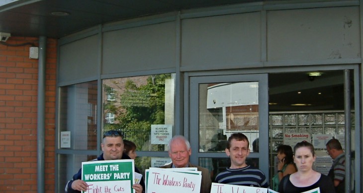 Photograph "Clondalkin dole protest" by The Workers Party of Ireland (no individual photographer mentioned). Uploaded to Flickr Creative Commons on August 15, 2010, taken on September 10, 2009 outside the Social Welfare Local Office, Clondalkin (County Dublin), Ireland. Protected under the CC BY-NC-SA 2.0 DEED license.